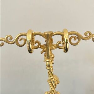 Gold colored hoop earrings with spring closure